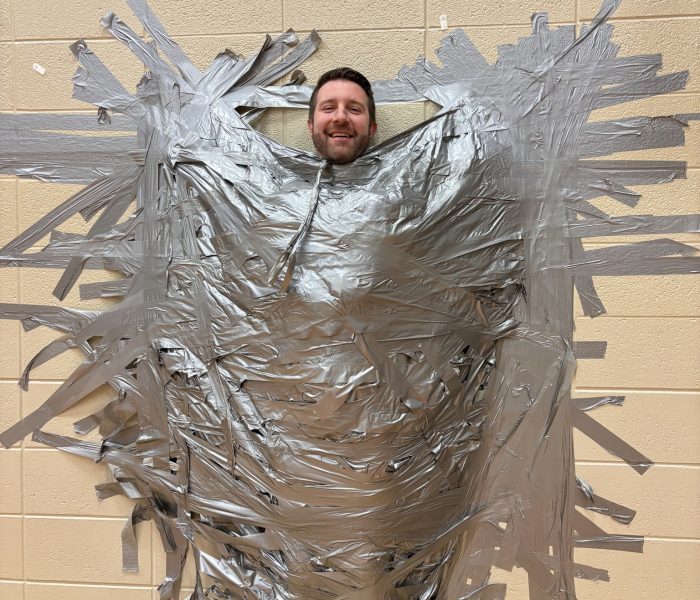 Mr staats taped to wall